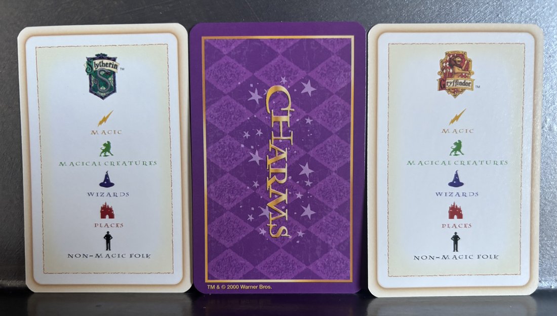 Trivia Game House and Charms cards, backs, showing the category icons and the Charms card back